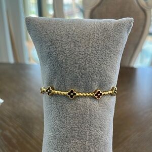 Elegant Gold and Black Clover Bracelet